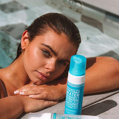 tanned woman in Coconut Water Self Tan Foam